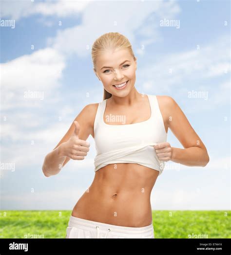 Sporty Woman Showing Thumbs Up Stock Photo Alamy