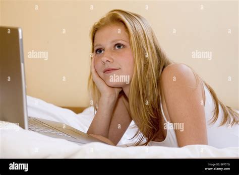 Teenage Girl Lying Down With Laptop Relaxation Stock Photo Alamy