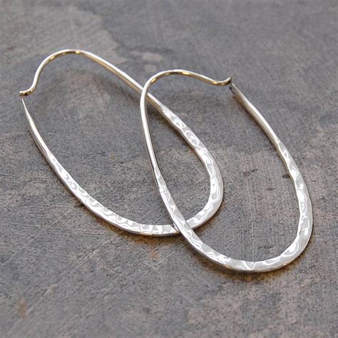 You can you're your favorite pair of hoops in sterling silver day after day if you so choose. sterling silver oval hoop earrings by otis jaxon silver ...