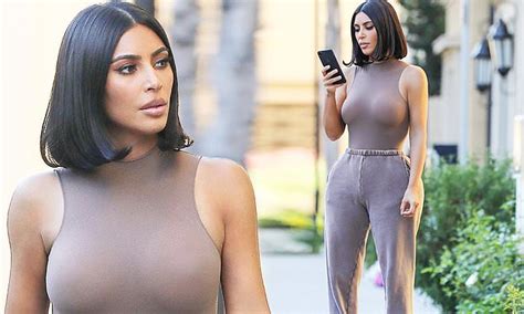 Kim Kardashian Showcases Her Tiny Waistline And Her Ample Cleavage In
