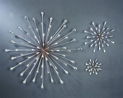 Easy to hang by metal hardware in back; Amazon.com - Tripar Small Starburst Metal Wall Art Decor - | Starburst wall art, Silver wall ...