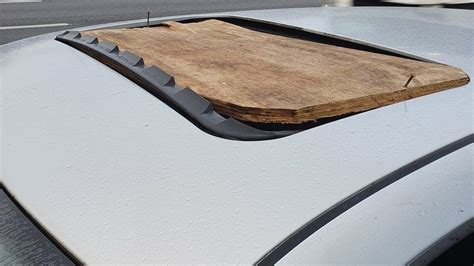Car Driven With Wooden Plank Nailed To Sunroof On M25 In Hertfordshire