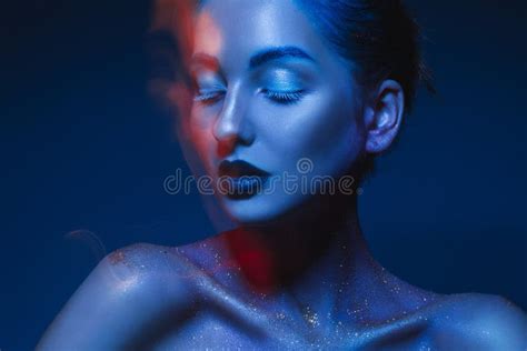 Horizontal Portrait Of Sensual Woman In Blue Body Art Stock Photo