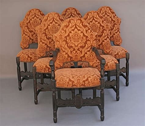 A set of six victorian walnut dining room chairs with oval shaped backs having delicately cartouche and scroll carved crested center, to the antique 19th century great britain (uk) victorian dining room chairs. Set of 6 Dark Walnut Upholstered Dining Chairs image 2