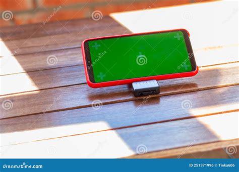 Cell Phone Lies Horizontally On Dark Wooden Table Big Touch Screen