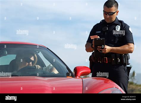 Traffic Cop Standing By Sports Car Stock Photo Alamy
