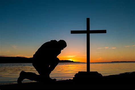 Best Kneeling In Prayer Stock Photos Pictures And Royalty Free Images