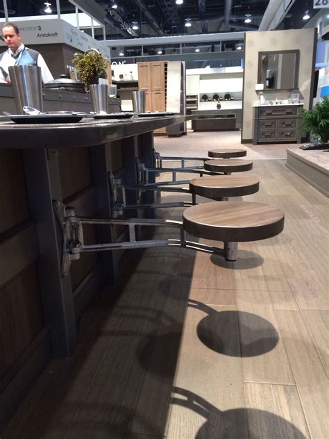 Maybe you would like to learn more about one of these? Swing-out stools are functional and a soace saver for the kitchen island area. #KBIS2014 ...