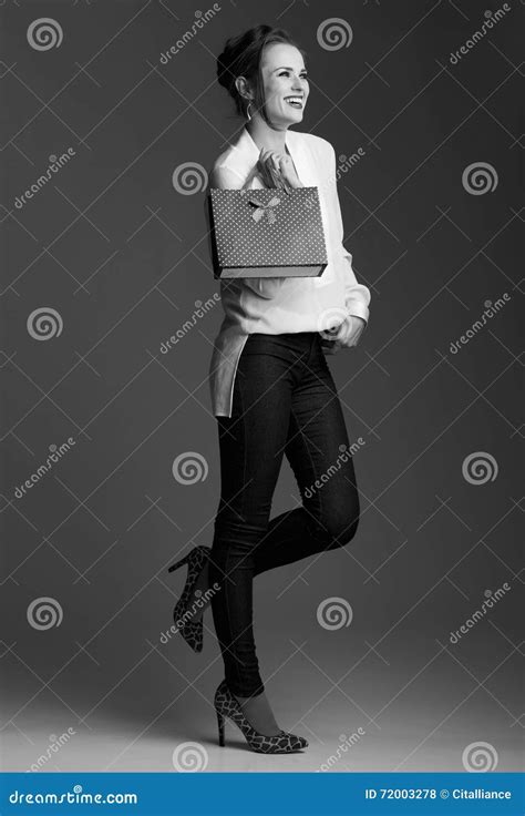 Happy Modern Elegant Woman With Shopping Bag Looking Aside Stock Photo