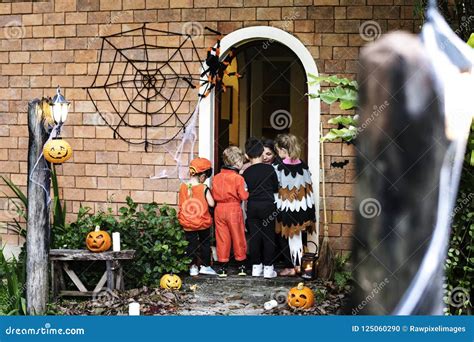 Little Children Trick Or Treating On Halloween Stock Photo Image Of