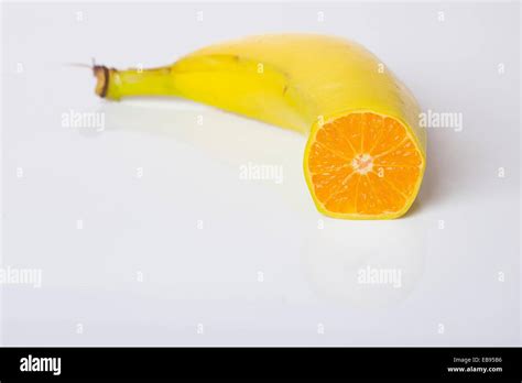 Digital Composite Of Orange And Banana Fruit Genetically Modified