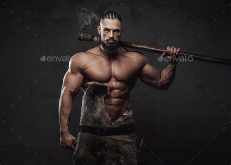 Viking With Huge Biceps And Naked Torso Posing With Axe Stock Photo By