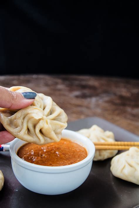Dim sum can be cooked by steaming and frying, among other methods. Steamed Veg Momos With Spicy Chili Chutney | Vegetable Dim Sum Recipe- foodrhythms