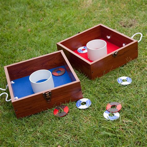 The game field consists of two washer pits, each containing one recessed cup of 4 inches in diameter (101.6 mm) positioned a specific distance apart, toward which players throw washers to score points. Halex Traditional Washer Toss - DO NOT USE at Hayneedle
