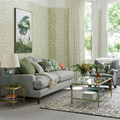 green living room ideas  fretwork wallpaper  grey sofa green