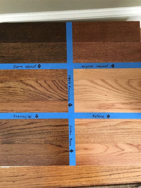 Wood Flooring Samples With Blue Tape On The Top And Bottom In