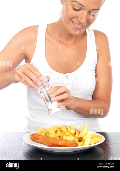 Woman Putting Salt On Chips Hi Res Stock Photography And Images Alamy