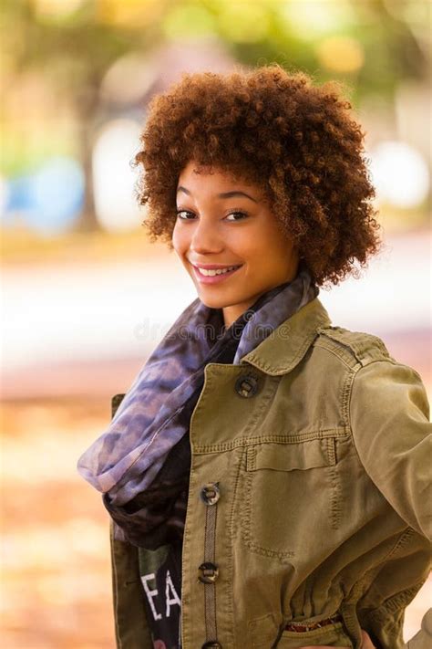 Autumn Outdoor Portrait Of Beautiful African American Young Woma Stock