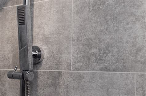 We like to mix different whites, we have 4 or 5 white or grey tones and they make whites more interesting. Grey Stone Tile - Bathroom Cladding Direct