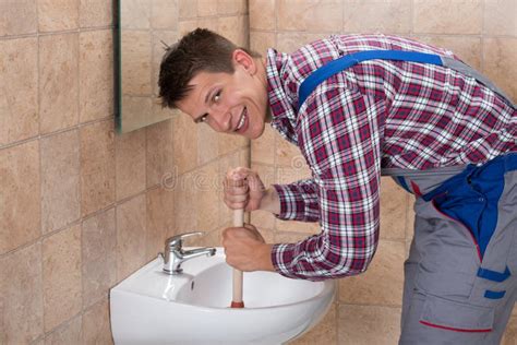 Happy Plumber Man Holding Plunger Stock Photos Free And Royalty Free