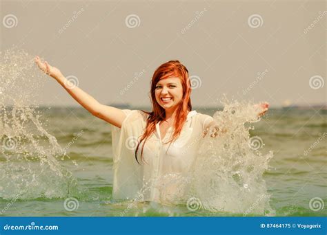 Redhead Woman Playing In Water During Summertime Stock Image Image Of Lifestyle Happiness
