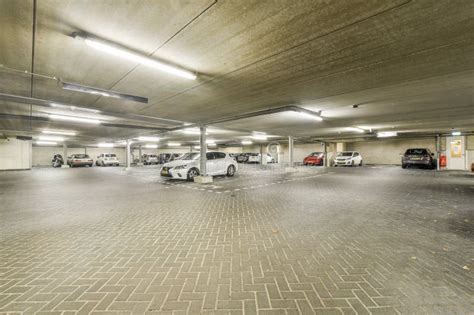 A Parking Garage With Cars Parked In It Editorial Stock Image Image