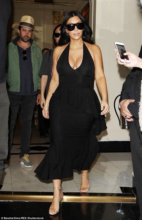 Kim Kardashian Flaunts Ample Cleavage In A Black Dress In London