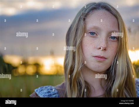 Portrait Of An Eight Year Old Girl In A Field Sunset On A Summers
