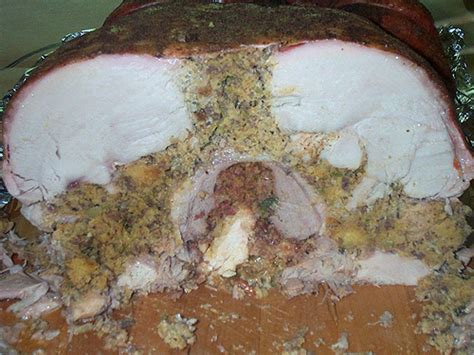 Place your boned and rolled turkey upon thick slices of onion on a baking tray. Turducken