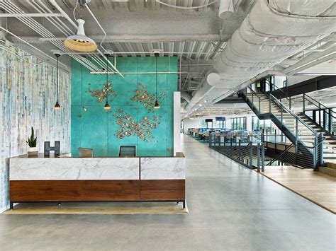 An Office Lobby With Blue Walls And Wood Accents