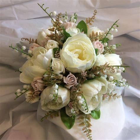 A Brides Bouquet Of Artificial Silk Ivory And Dusky Pink Peony And Roses