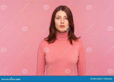 Portrait Of Serious Self Assured Brunette Woman Looking At Camera With Confidence Sensuality