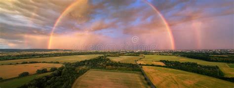 Panoramic Aerial View Of A Huge Rainbow During A Dramatic Sunset Over