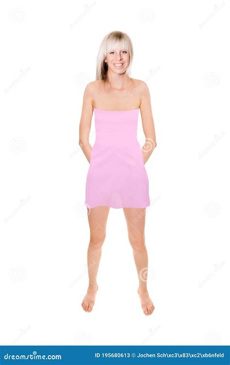 Full Length Portrait Of A Cheerful Blonde Woman Wearing A Short Pink