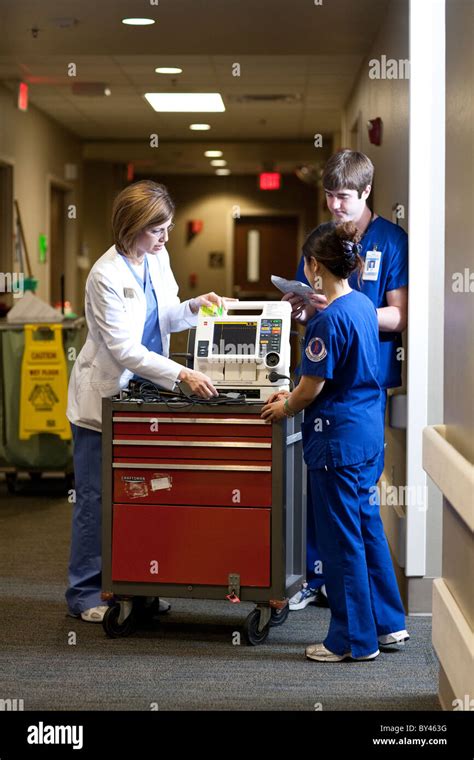 Nurse Instructor Shows Nursing Students How To Use Medical Diagnostic