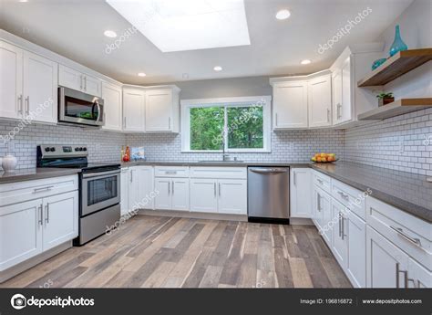 Open Concept Kitchen White Cabinets Grey Quartz Countertops Tile