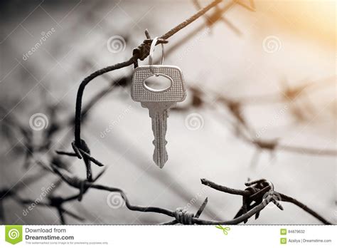 Key Hangs On A Rusty Barbed Wire Stock Photo Image Of Interdiction