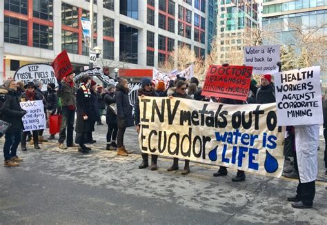 large crowd blocks downtown street in protest against mining industry convention cbc news