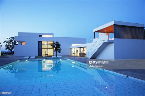 Pool Outside Modern House At Twilight High Res Stock Photo Getty Images