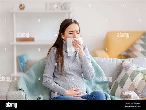 Coughing Pregnant Woman At Home Stock Photo Alamy