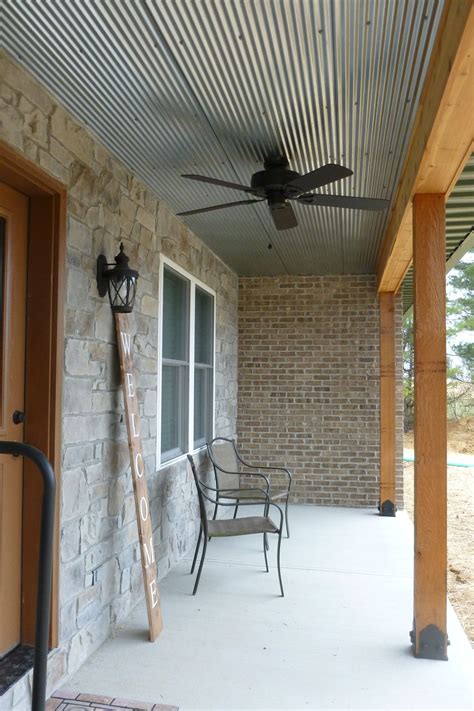 Provides appropriate height, strength, and beauty to your exterior porch rail. Front porch. Stone front wall with corrugated steel ...
