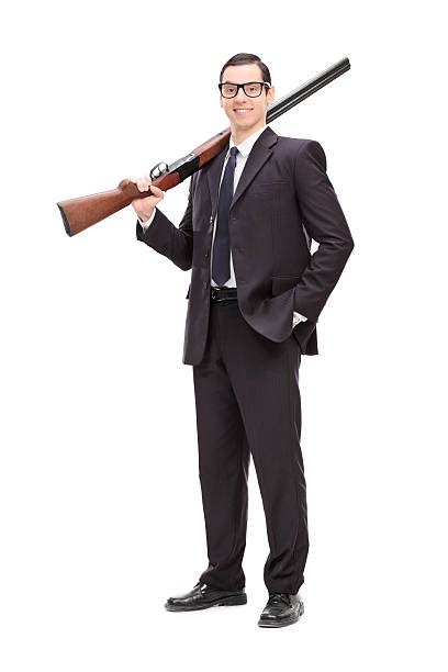 2100 Man Holding Shotgun Stock Photos Pictures And Royalty Free Images