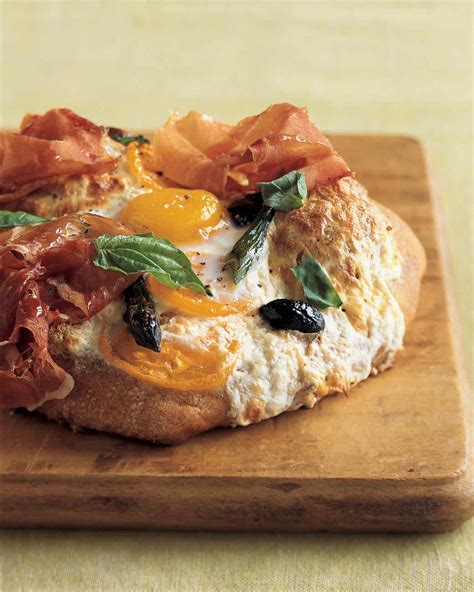 Eggs Baked Atop Individual Pizzas With Thinly Sliced Prosciutto Add A Ham And Egg Heartiness To