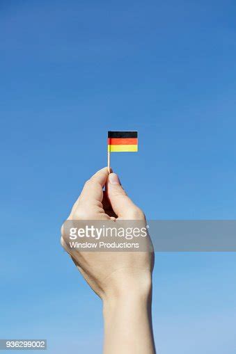 Woman Holding German Flag In Hand High Res Stock Photo Getty Images