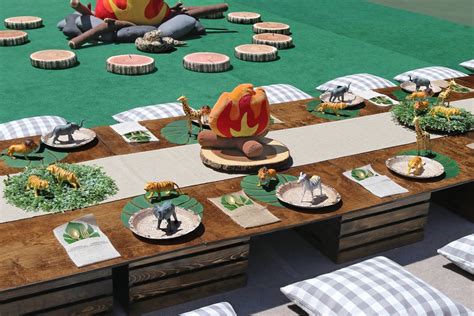 Woven placemats, glass mini vases, diamond scatters, artificial flower bouquets, and other table decorations. IMG_5439 copy 2500.jpg | Safari theme party, Safari party ...