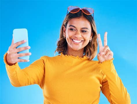 Selfie Smile Studio And Peace Sign Of A Woman Influencer Taking A