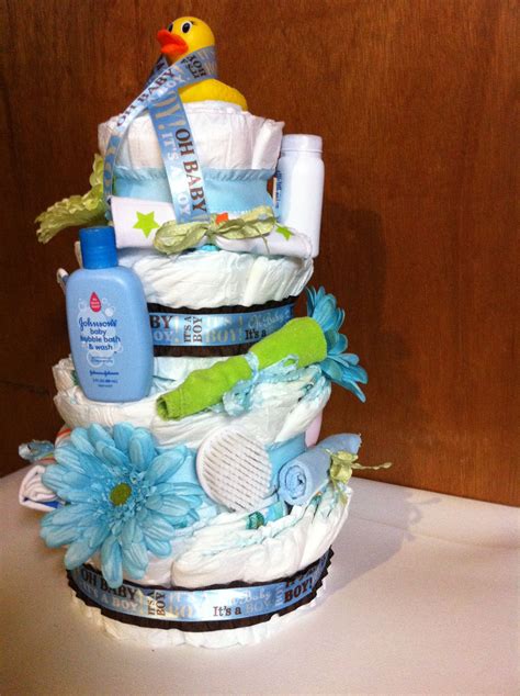 Learn how to make an adorable and practical diaper cake. DIY Diaper cake for boy baby shower gift | Baby shower ...