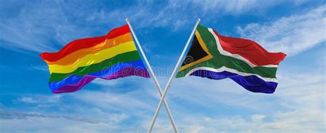 crossed flags of lgbt and south africa flag waving in the wind at cloudy sky freedom and love