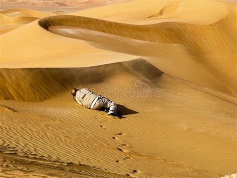 National Geographic Photographer Photographing Sand Blowing Off Desert