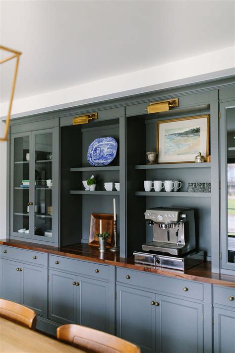 A bowl full of lemons. Slate Gray Bookcase with a built-in coffee station + brass ...